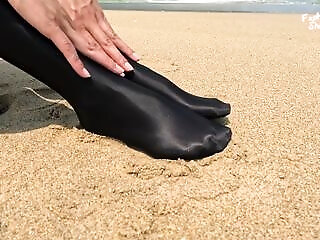 863 Shiny Black Stockings On The Beach